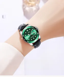 Classic green dial quartz watch with leather strap and magnifying date window on wrist