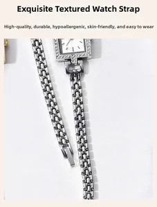 Detailed view of polished silver alloy square watch band with decorative crystals