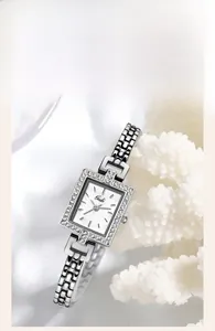 Detail of Gedi square lady watch with zircon bezel and pearl dial on white coral