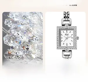 Detail of silver square watch with mother-of-pearl dial and diamond-set bezel