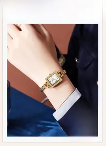 Elegant gold chain watch for women featuring a square dial with shimmering accents