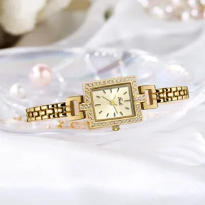 Elegant gold rectangular quartz watch for women with sparkling rhinestone-set bezel and chain