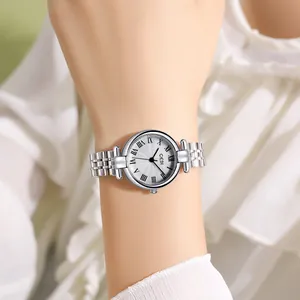 Elegant silver GEDI quartz watch with Roman numerals and stainless steel strap on wrist