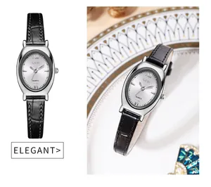 Detail view of elegant oval quartz watch with black leather strap and Roman numerals
