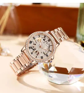 Macro view of rose gold skeleton watch dial with sparkling crystals and Roman numerals
