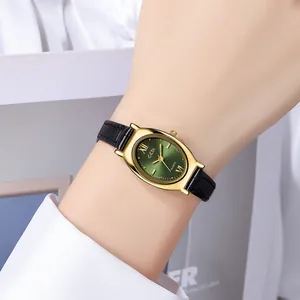 Elegant women's quartz watch with oval gold case and green dial on a model's wrist