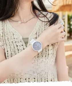 Detail of GEDI silicone watch featuring classic three-hand dial and luminous markers