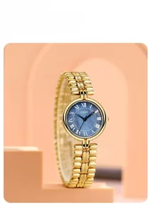 Close-up of GEDI vintage gold watch featuring a navy blue sunburst Roman numeral dial