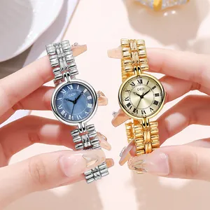 Vintage women's quartz watch with roman numerals and slim metal strap in silver and gold