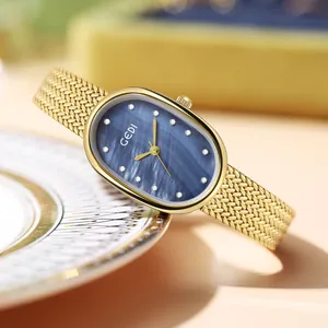 Montre à quartz dorée élégante avec cadran ovale en nacre bleue et index en cristal