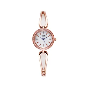 Elegant rose gold women's watch with rhinestone bezel and water-drop bracelet strap