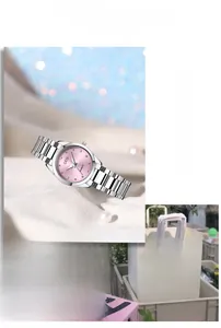 Detail of GEDI quartz watch featuring a pink dial with crystals and silver steel strap