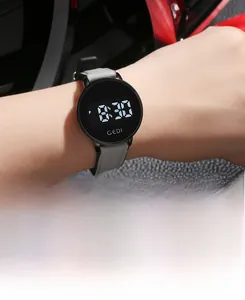 Macro detail of GEDI digital watch with grey leather strap and LED stopwatch display