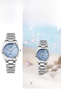 Detail of elegant ladies quartz watch with light blue mother of pearl dial and silver band