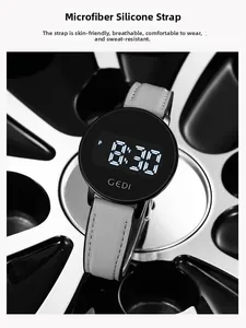 Detail of GEDI digital watch with grey microfiber silicone strap and white stitching