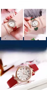 Dettaglio orologio in oro rosa con diamanti, quadrante bianco e cinturini in pelle