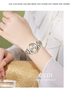 Close-up of GEDI quartz watch with silver and rose gold steel strap on model wrist