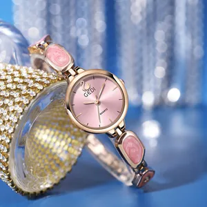 Elegant rose gold bracelet watch with pink marble enamel inlay and quartz dial