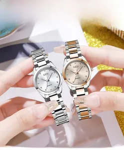 Detail of elegant quartz watches with diamond markers and stylish steel straps