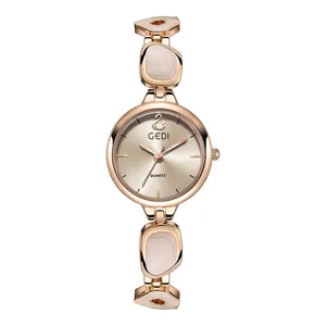 Elegant rose gold women's watch with swan logo dial and pearl inlay strap detail