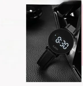Macro detail of GEDI digital sports watch with black litchi texture silicone strap