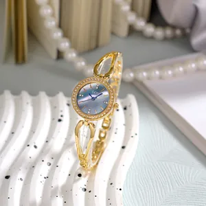 Montre Bracelet de Luxe en Strass pour Femme Fashion Ajouré Alliage Montre à Quartz pour Dame Élégante Étanche Quotidien Bijoux
