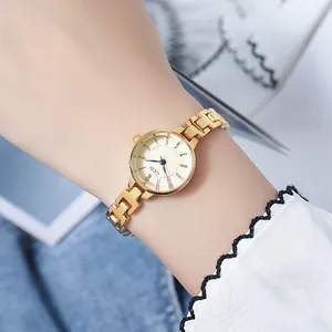 GEDI Women's Gold Quartz Watch with H-link Metal Strap and Beige Dial on Wrist