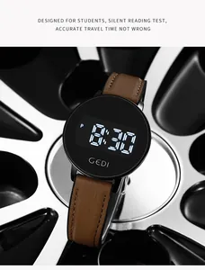 Detail of GEDI digital watch with brown leather strap displayed on a metallic wheel