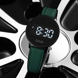 Minimalist digital sports watch with dark green leather strap on metallic background