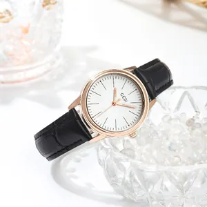 Elegant rose gold women's watch with white dial and black crocodile leather strap