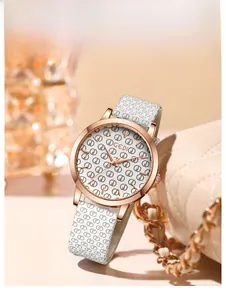 Detail of GEDI quartz watch featuring rose gold case and white leather logo pattern strap