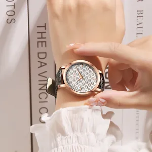 Elegant women's quartz watch with GEDI pattern dial and black leather strap on wrist