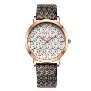 Elegant rose gold quartz watch with white dial and patterned brown leather strap