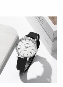 Detailed macro view of white watch dial with Roman numerals and GEDI branding