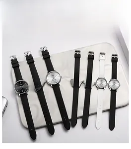 Flat lay of minimalist GEDI quartz watches with colorful dials and silicone straps