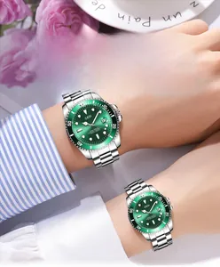 Detail shot of GEDI couple watches with green sunray dials and silver steel bands