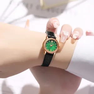 Luxury rose gold women's watch with green dial, diamond bezel and black leather strap