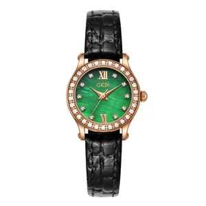 Luxury rose gold women's quartz watch with emerald green dial and black leather strap