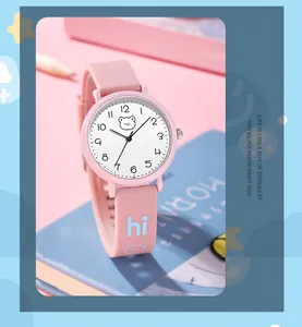 Macro view of pink silicone watch strap with blue 'hi' text and cute bear pattern