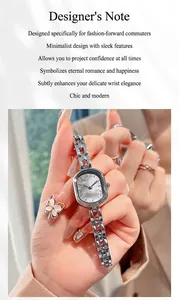 Detail of silver alloy chain watch with mother-of-pearl dial and butterfly ring set