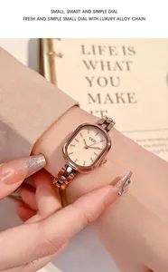 Close-up of elegant rose gold alloy link watch featuring a champagne oval dial for women