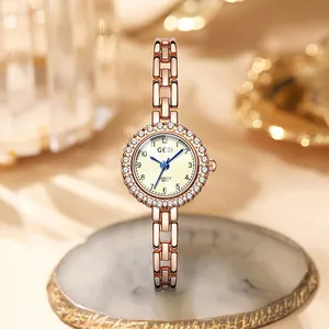 Elegant rose gold quartz watch for women with rhinestone bezel and chain bracelet