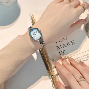 Elegant women's quartz watch with oval mother of pearl dial and silver metal bracelet