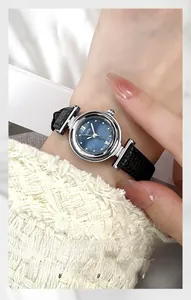 Detail of GEDI quartz watch with deep blue mother of pearl dial and black leather strap