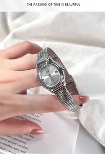 Close-up of Gedi women watch featuring silver mesh band and sunray dial with date window