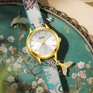 GEDI Women's quartz watch with tricolor woven strap and gold fishtail pendant
