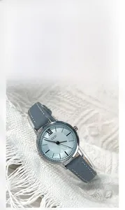 Close-up of GEDI vintage quartz watch with blue dial and leather strap detail