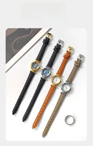 Detail of four quartz watches with lychee grain leather straps and mother-of-pearl dials