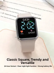 Detail of square silver digital watch with soft silicone strap and clear LED display screen