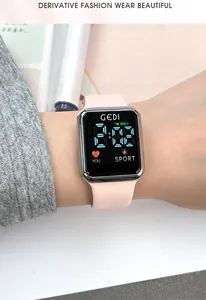 Close-up of GEDI digital sports watch with pink silicone strap and blue LED display
